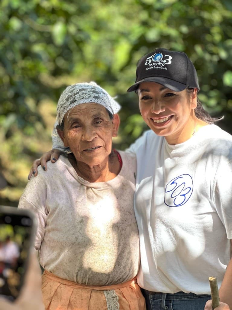 A coffee farmer and a 503 Cafecito teammate at the farm